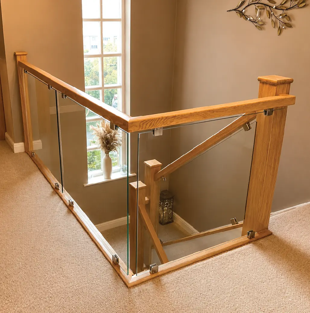 Oak and glass landing balustrade beside a window in a period property